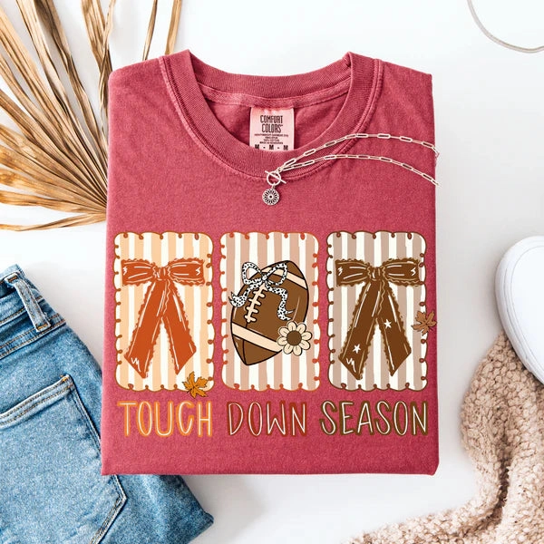 On-the-Go Fashion Online Exclusive | Block Touch Down Season Bows Graphic on Short Sleeve Comfort Color Tee in Crimson Red