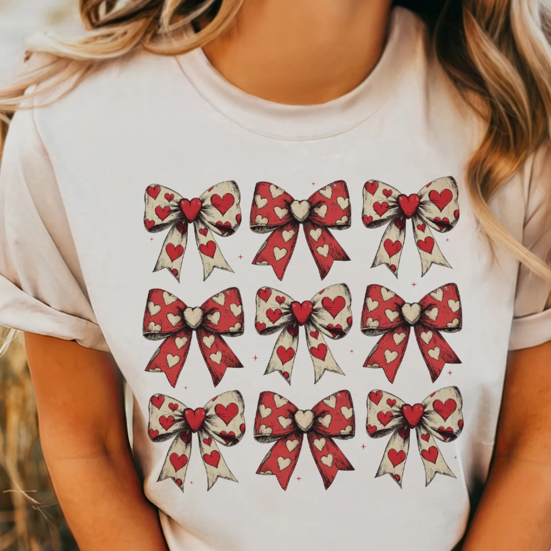 Minimalist Stitching V neck elegance Online Exclusive | On Cloud 9 Assortment of Bows with Hearts Graphic Tee in Cream