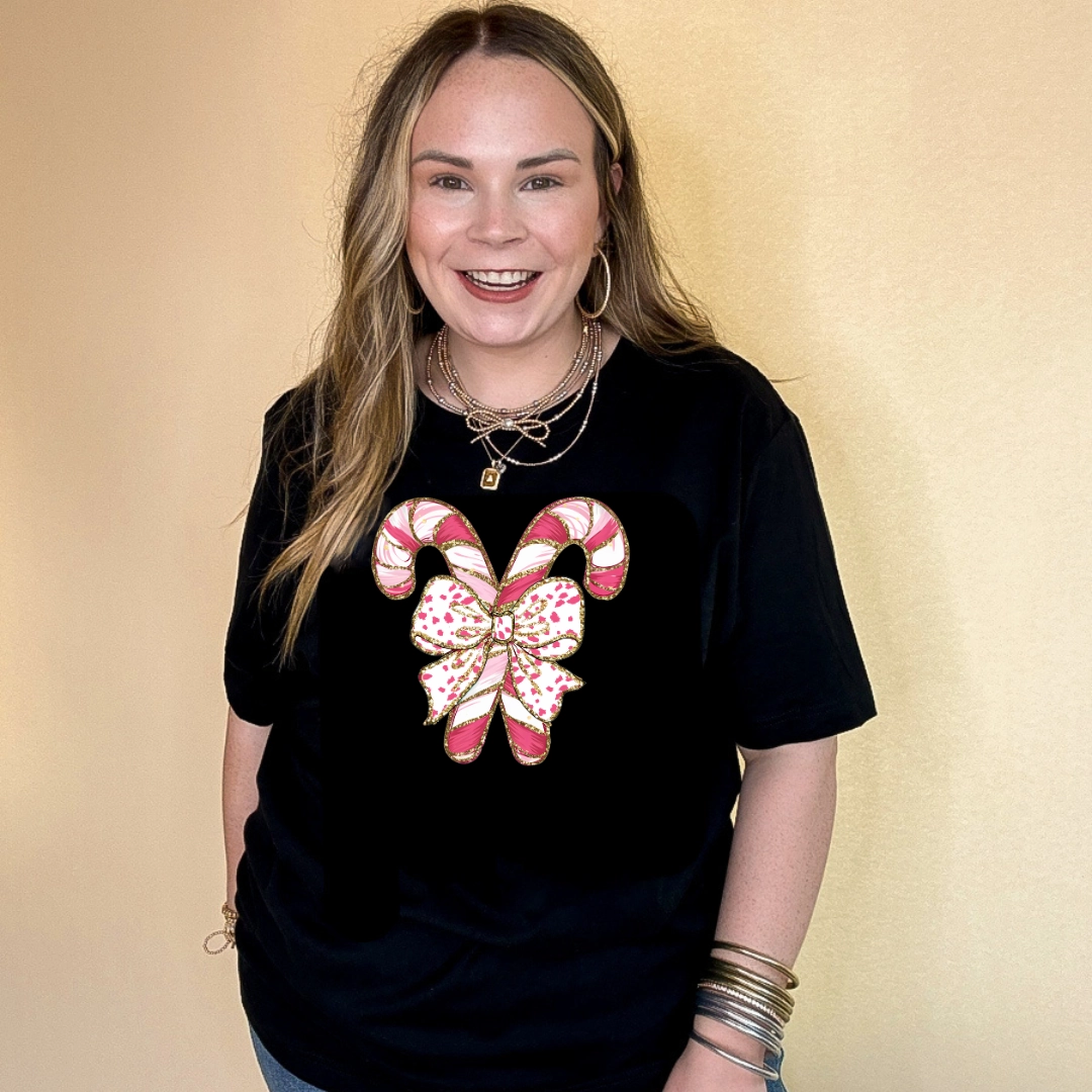 Online Exclusive | Pink Swirl Candy Cane Tied with Bow Graphic Tee in Multiple Color Options Ribbed Neckline