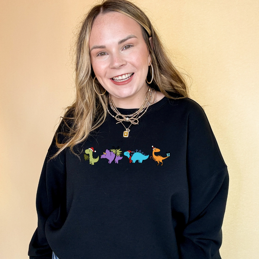 Online Exclusive | Holiday Dinosaur Parade Graphic Sweatshirt in Multiple Color Options Soft & Smooth Unisex versatility