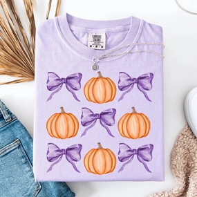 Trendy Bright and Bold Online Exclusive | Pumpkins & Bows Graphic on Short Sleeve Comfort Color Tee in Orchid Purple