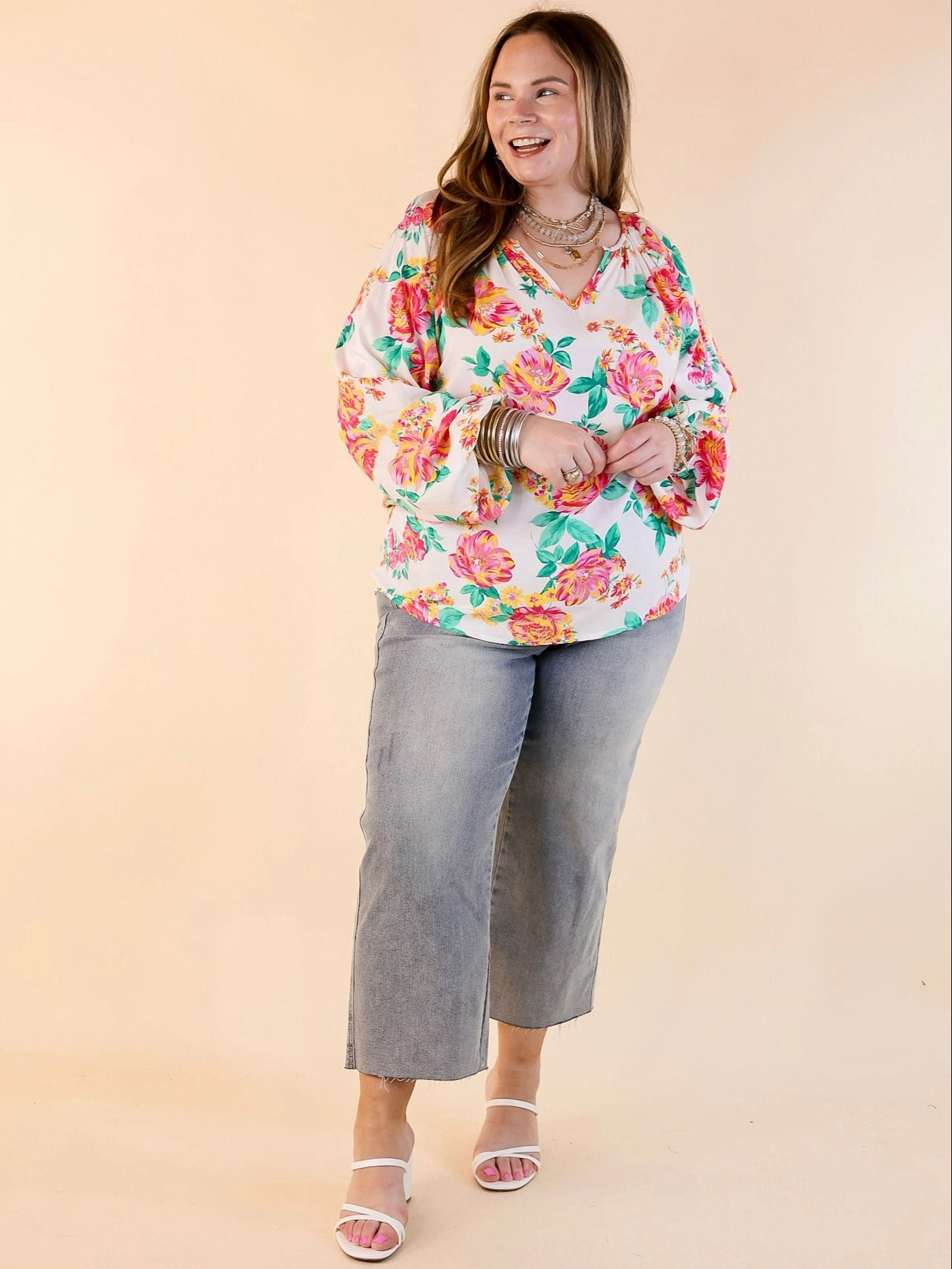 Follow Your Happiness Notched V Neck Floral Top with Long Sleeves in White Sustainable production