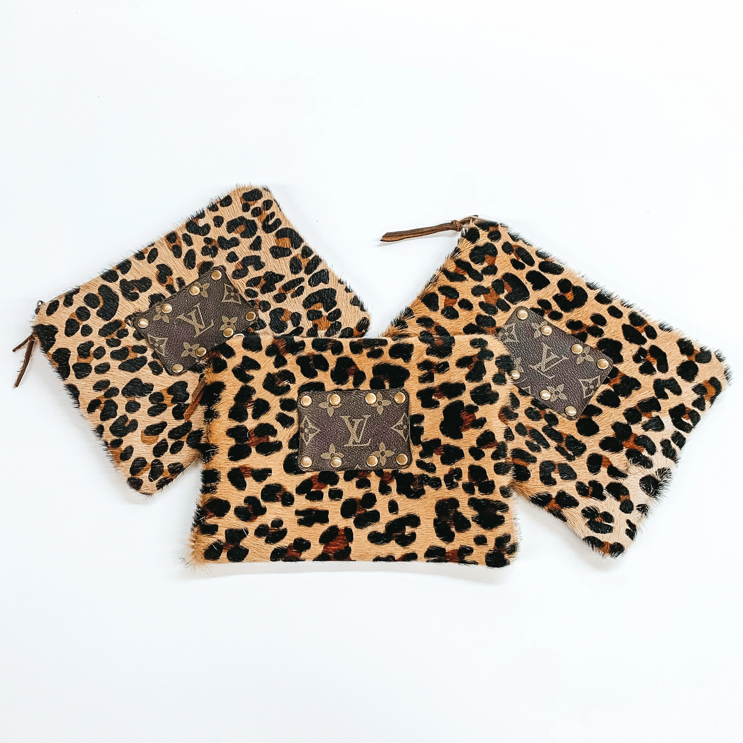 Keep It Gypsy | Leopard Print Cowhide Make Up Bag with a Leather Embellishment Hotel Style LayeredConstruction