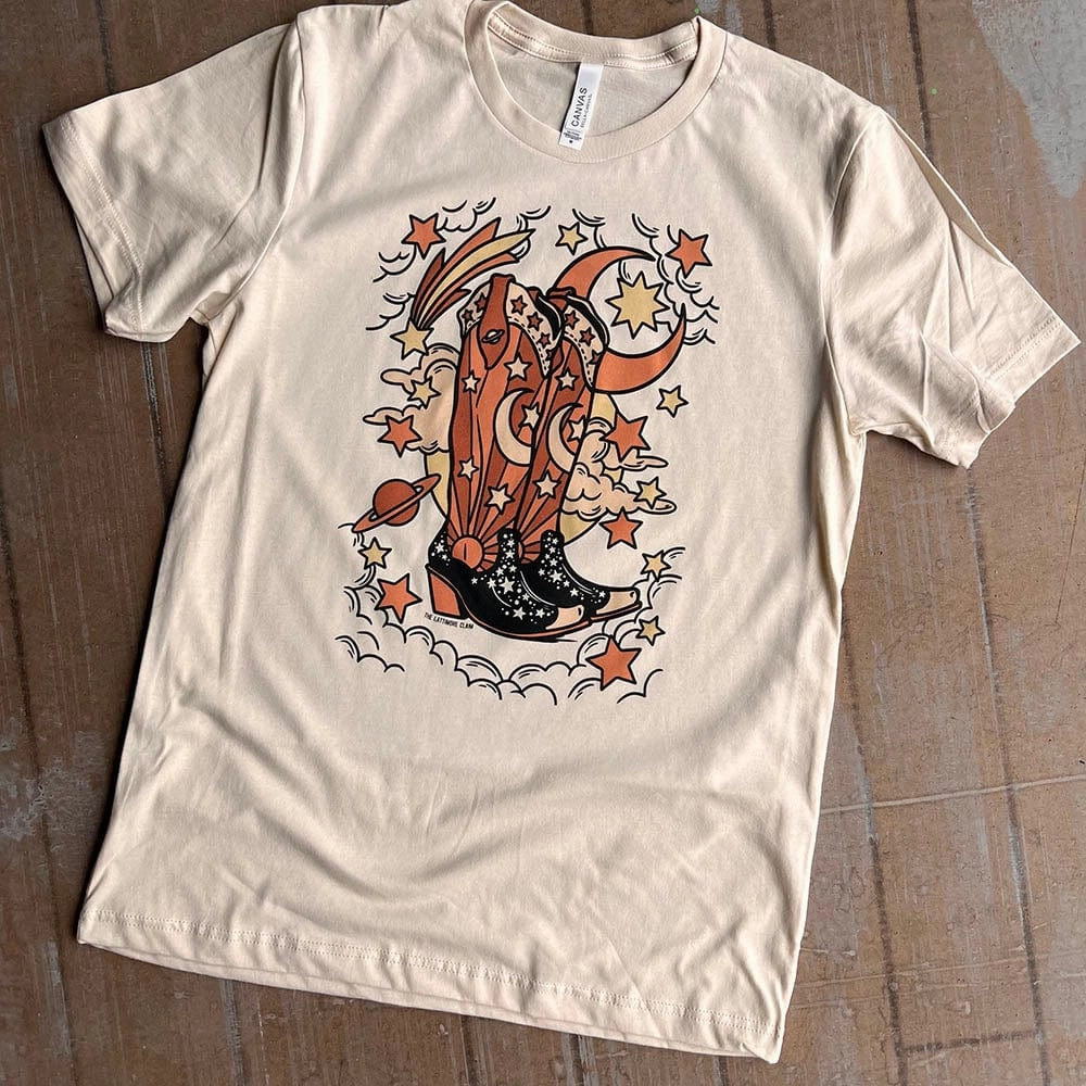 Ocean Air FourWayStretchClothing Online Exclusive | Cosmic Boots Graphic Tee in Cream