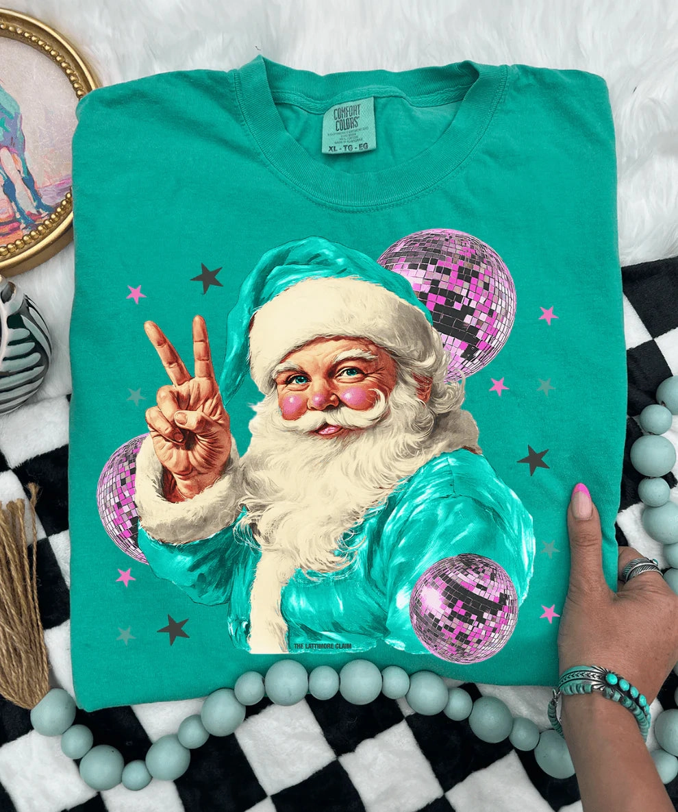 Online Exclusive | Disco Santa Peace Hand Graphic on Short Sleeve Comfort Color Tee in Island Green Feminine Appeal
