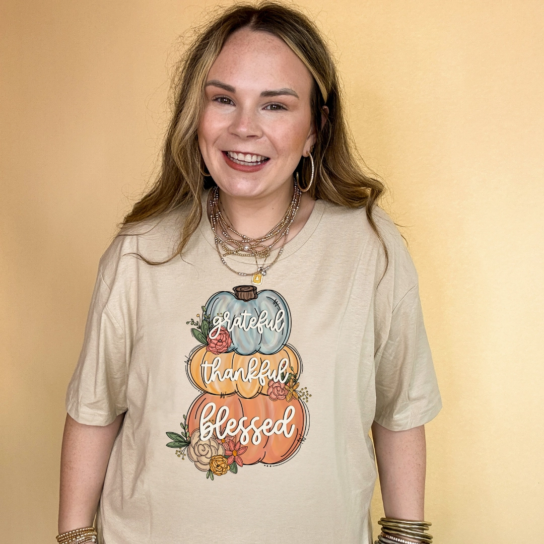 Stylish Day Wear Online Exclusive | Grateful, Thankful, Blessed Stacked Pumpkins and Floral Arrangement Graphic Tee in Multiple Color Options
