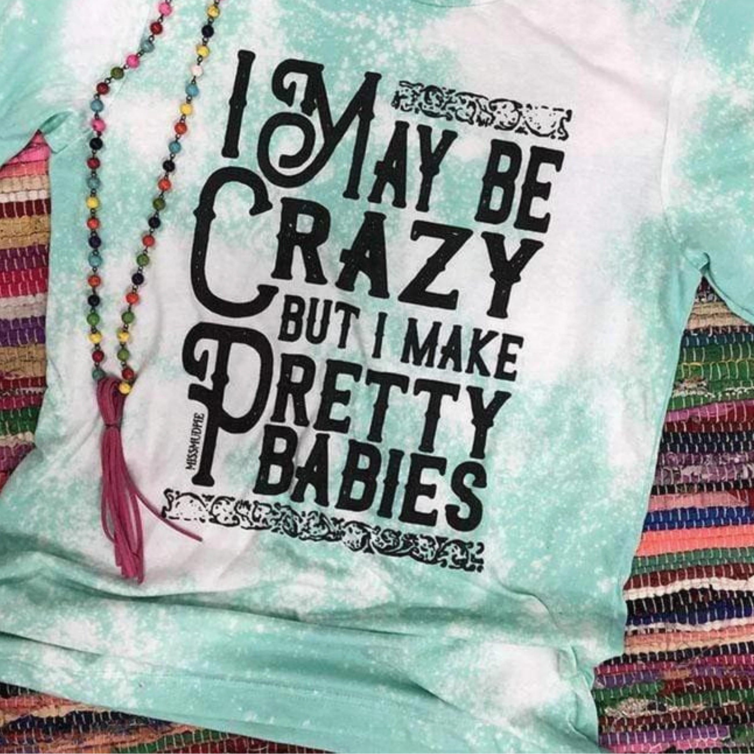 Online Exclusive | I May Be Crazy but I Make Pretty Babies Short Sleeve Bleached Graphic Tee in Mint Blue Ribbed Collar Design