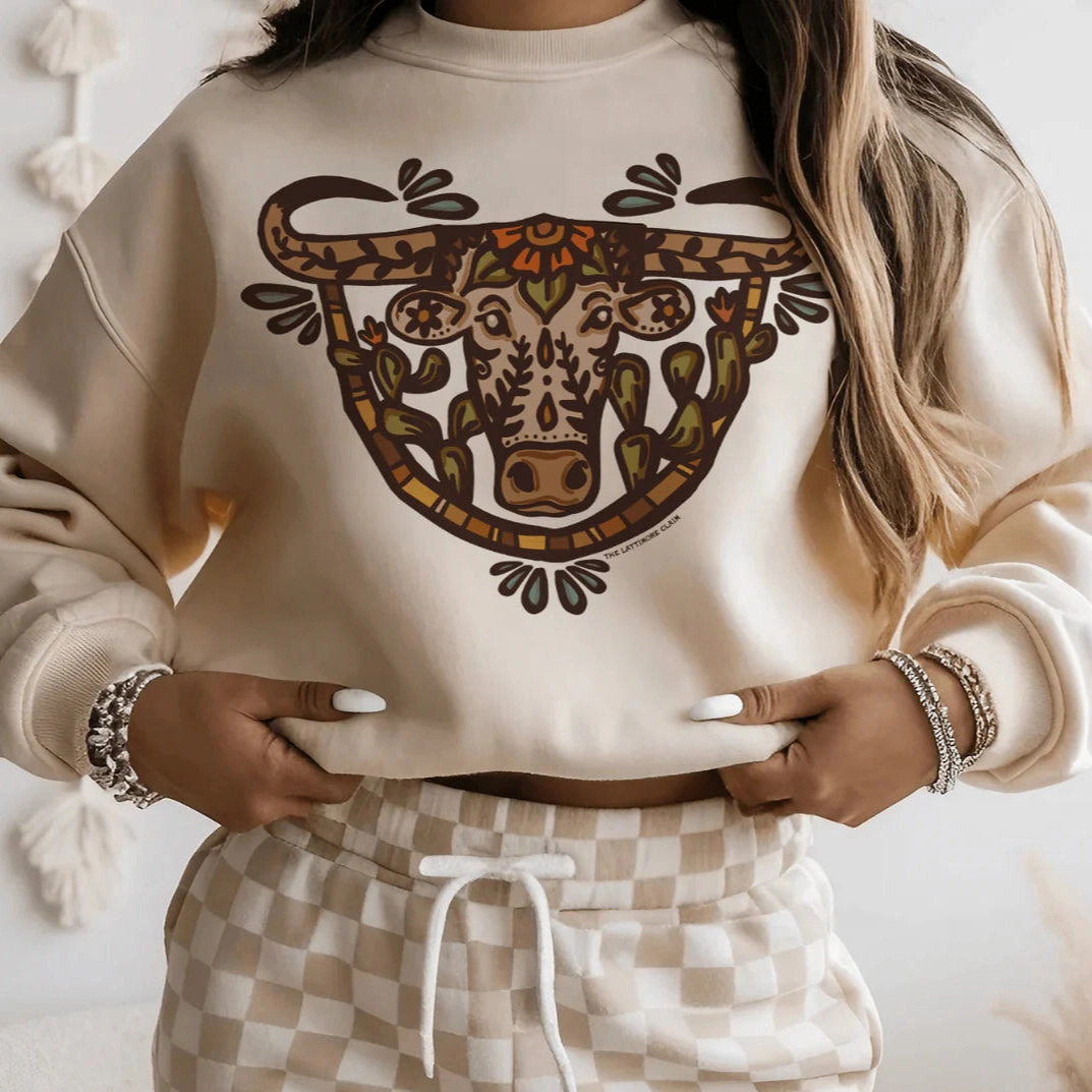 Online Exclusive | The Wild Watusi Long Sleeve Graphic Sweatshirt in Cream Street Smart