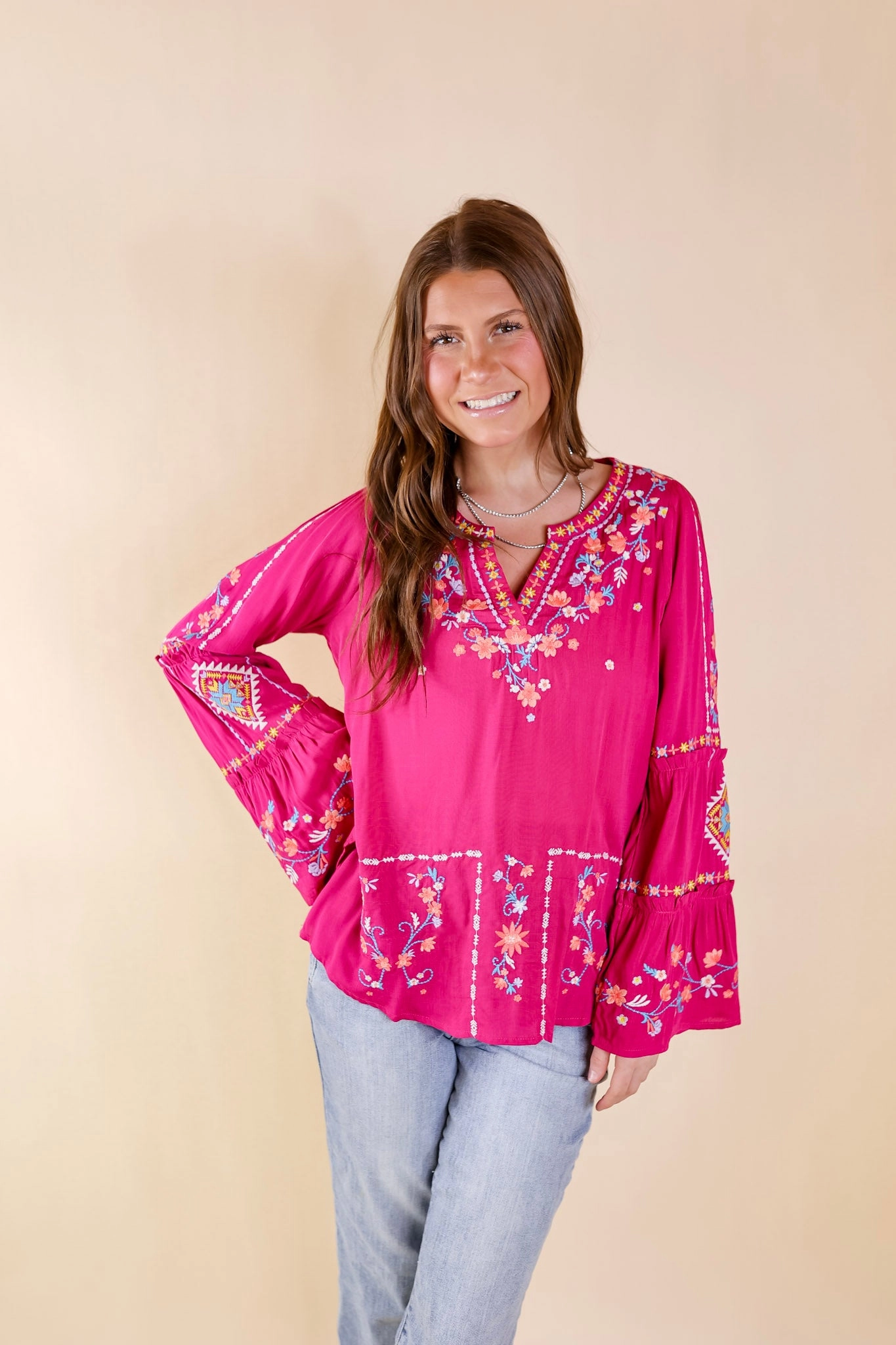 Machine Washable Fabric Pretty Stroll Floral Embroidered Top with Long Bell Sleeves in Magenta Pink