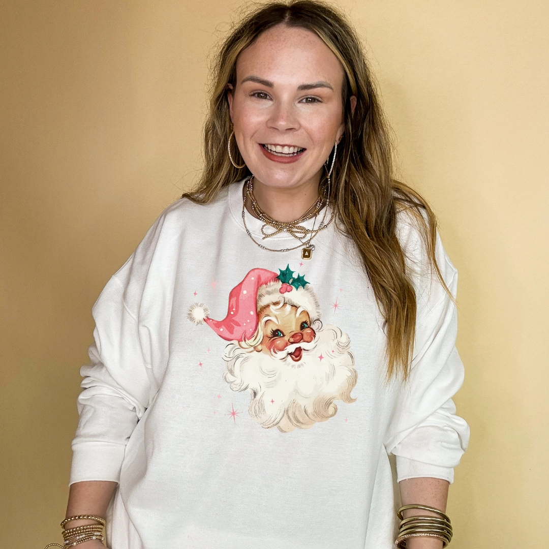 Online Exclusive | Santa Face with Pink Santa Hat Graphic Sweatshirt in Multiple Color Options Soft touch finish Long Sleeve