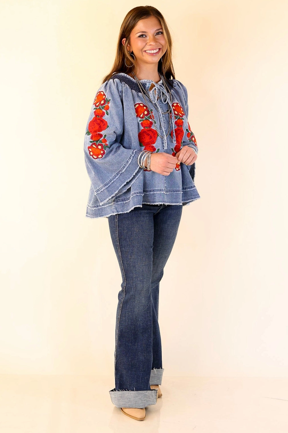 Glossy Texture Round Collar Rodeo Quincy | Tia Carmen Flowy Denim Blouse with Red Rose Embroidery