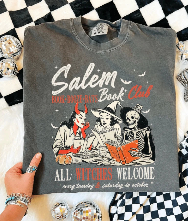 Online Exclusive | Salem Book Club Halloween Graphic on Short Sleeve Comfort Color Tee in Pepper Black AntiPillingTreatment