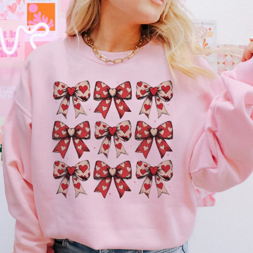 Online Exclusive | On Cloud 9 Assortment of Bows with Hearts Graphic Sweatshirt in Pink Urban Trend Look Travel Ready